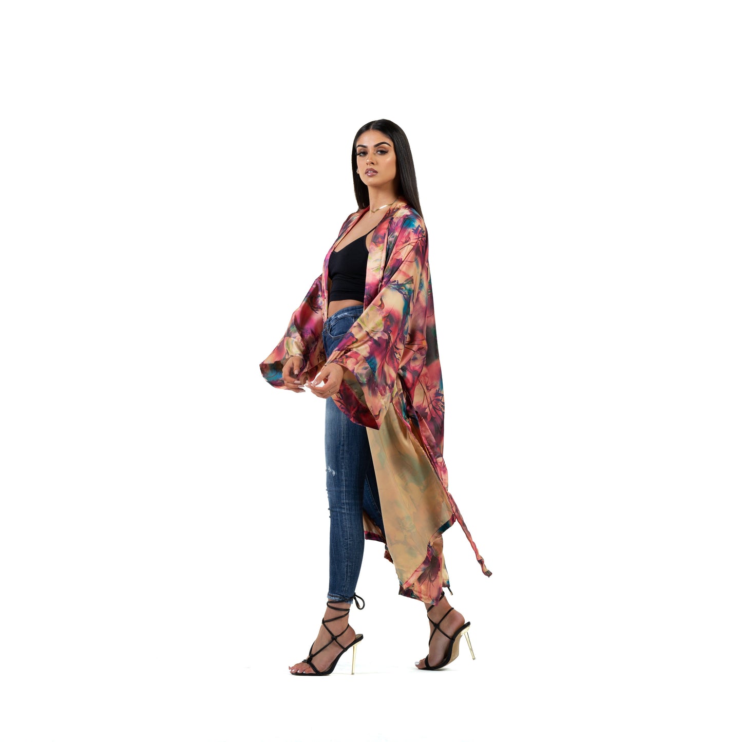 Natalie Anderson satin sunset kimono in orange, pink, nude and teal - model side view jeans and heels